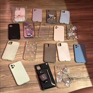 16 used phone cases for iPhones 11,12, and 1 new Disney phone case for iPhone 13
